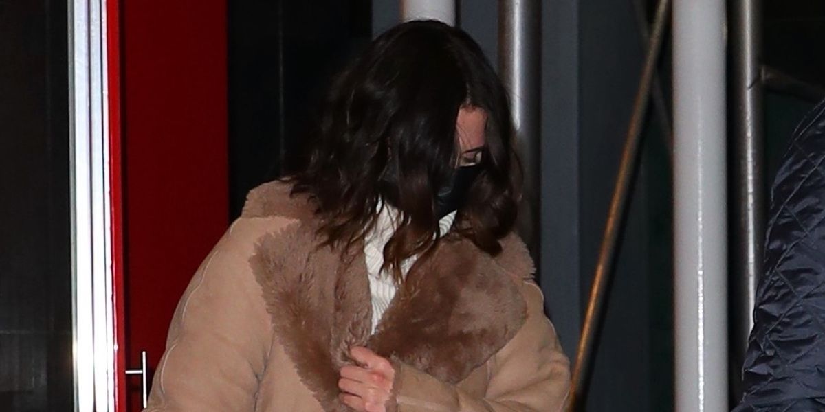 Selena Gomez Had Dinner With Cara Delevingne in a Great White Sweater Dress, Teddy Coat, and Boots - ELLE