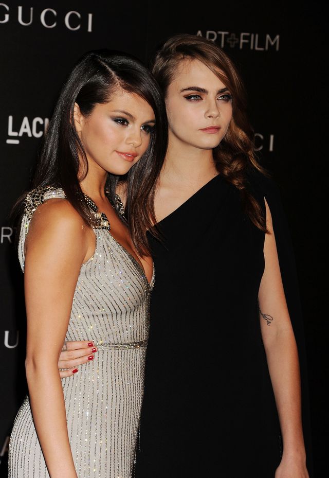 los angeles, ca   november 01 actresssinger selena gomez l and actress cara delevingne attend the 2014 lacma art  film gala honoring barbara kruger and quentin tarantino presented by gucci at lacma on november 1, 2014 in los angeles, californiaphoto by jeffrey mayerwireimage