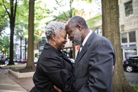 senior couple embracing in downtown area