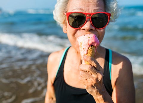 Senior woman eating an ice-cream Senior woman eating an ice-cream