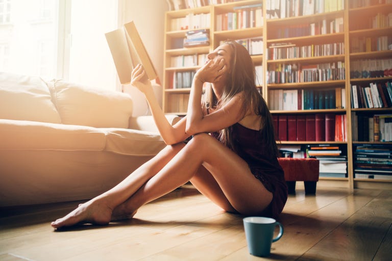 Sexy woman reading a book