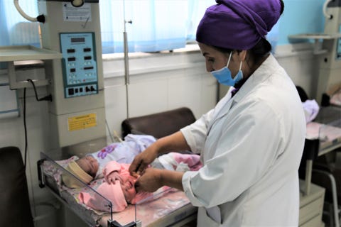 shahla oruzgani﻿ treating a baby at malalai maternity hospital in kabul