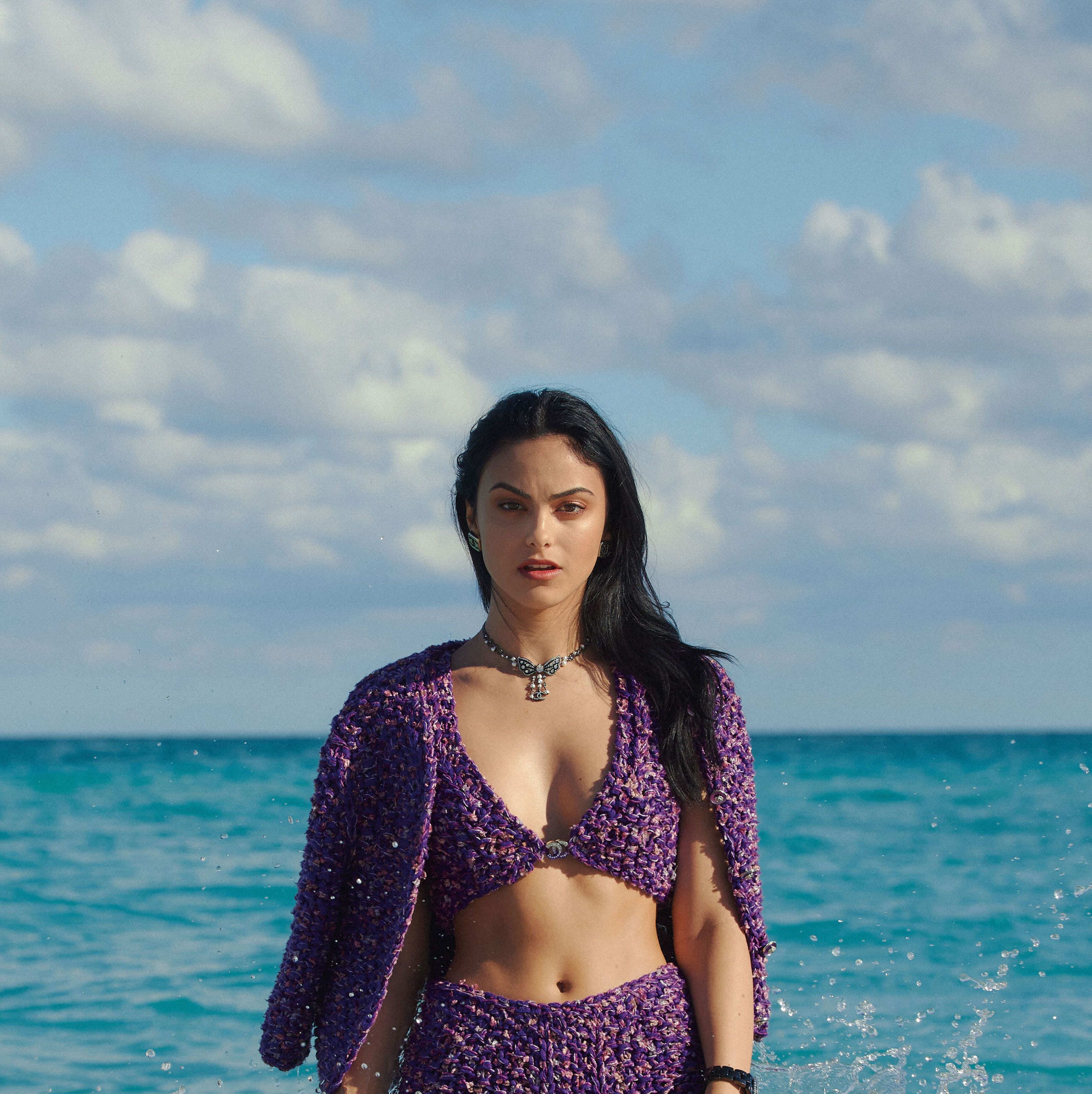 Is the ocean bigger than Camila Mendes? Certainly—but also, in some respects, no. In real life, Mendes is 5’2” while the Atlantic Ocean takes up nearly 41 million miles. Watch the <I>Riverdale</I> star wade through waves in Miami—even while wearing some gasp-worthy beachwear from Chanel—and it’s easy to lose her between the blue-green swells that smash the horizon. She’s just one girl, after all, and the ocean is eternal.

<br><br>That’s in the physical realm, anyway. What happens when you view Mendes through your phone is a little different. For starters, the 27-year-old is captivating onscreen, with a wide open face she knows how to use. (After four years of training at NYU’s prestigious Tisch School of the Arts, it seems her eyebrows alone have mastered the Stanislavski method of “react first, think later.”) Put a camera on her in the Atlantic, as photographer Tyler Joe did at the shoreline of the Faena Hotel, and suddenly you think, What ocean?

<br><br>Then there’s the data. In the vast corner of the internet known as TikTok, #CamilaMendes content has been viewed roughly 2 billion times. The #AtlanticOcean? About 175 million. We could twist this fact into a parable about environmentalism and Hollywood, or a lament about the attention span of the American teen. Or we could simply accept that in some realms of reality, Mendes is essentially a force of nature.