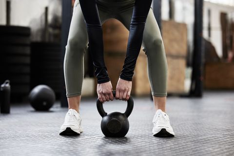 shot of a woman working out with a kettle bell
