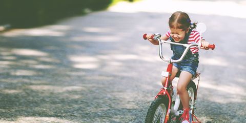 happy girl riding bike
