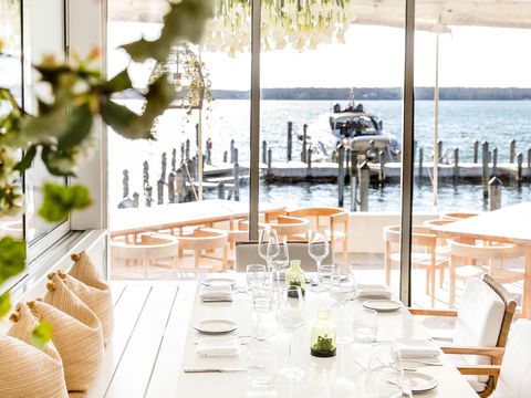 a set table at the si si restaurant on the marina in the hamptons
