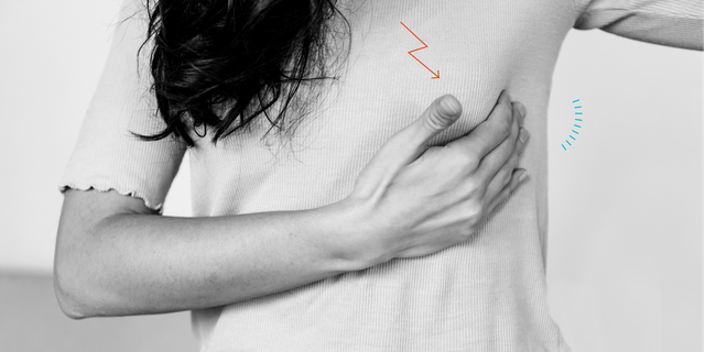 woman touching chest