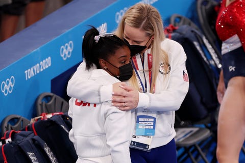 simone biles was embraced by coach cecile landi