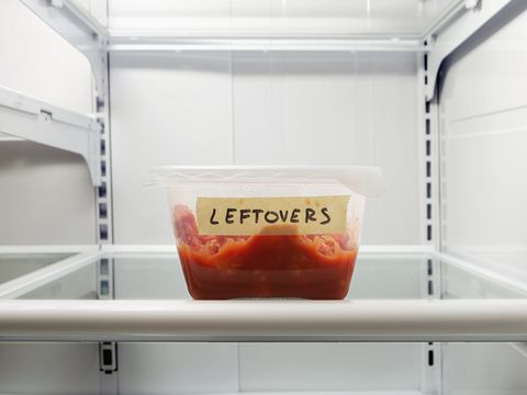 single leftover container on refrigerator shelf