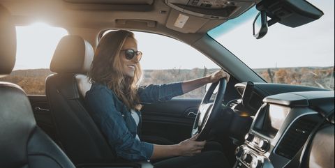single woman driving a car