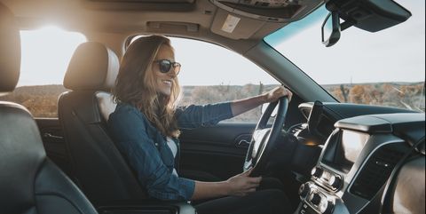 single woman driving a car