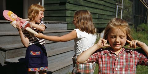 Plugging Ears as Girls Fight over Doll