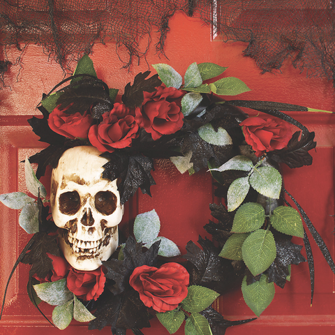 wreath with skull, red roses, black glitter leaves, and some green leaves