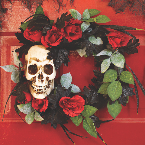 wreath with skull, red roses, black glitter leaves, and some green leaves