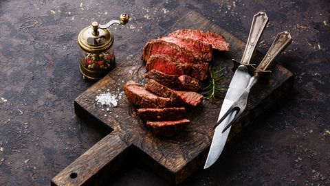 Sliced steak roastbeef with knife and fork
