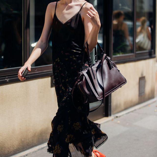 paris, france   july 1 model remington williams wears a black slip dress and brown  coach purse during couture fallwinter 2018 fashion week on july 1, 2018 in paris, france photo by melodie jenggetty images