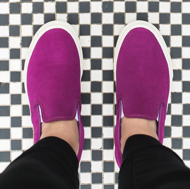 magenta slip on sneakers on checkerboard tile floor