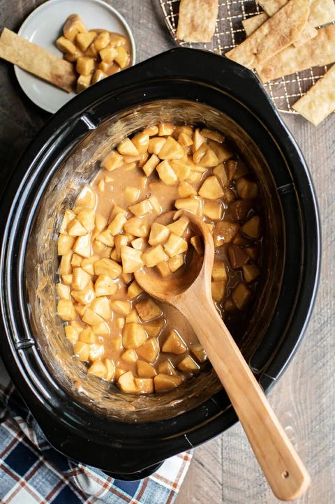 slow cooker dips apple caramel pie dip with wooden spoon