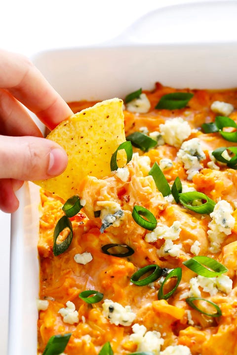 slow cooker dips buffalo cauliflower dip with hand and chip