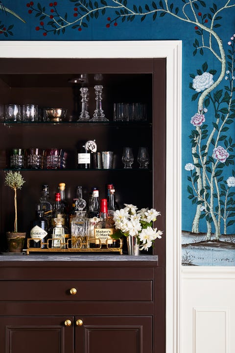 living room with blue wallpaper and bar nook