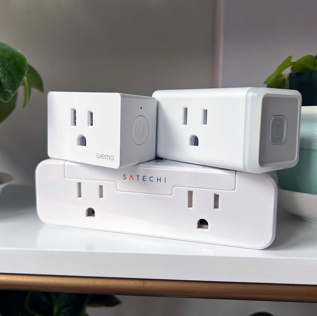 satechi kasa and wemo smart plugs on shelf with plants