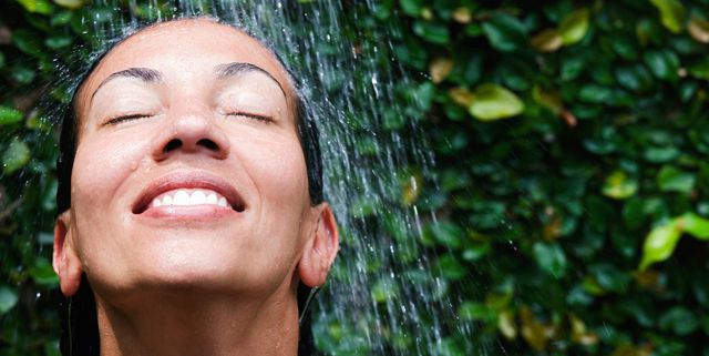 smiling colored woman in the shower