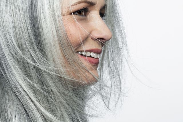 smiling grey haired woman, profile