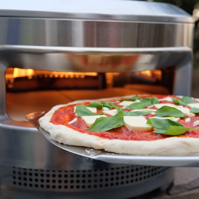 pizza going into the solo stove pi pizza oven