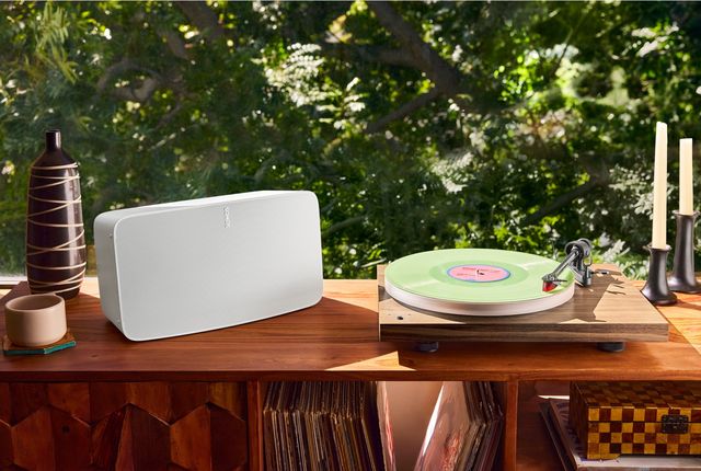 a speaker and record player on a table