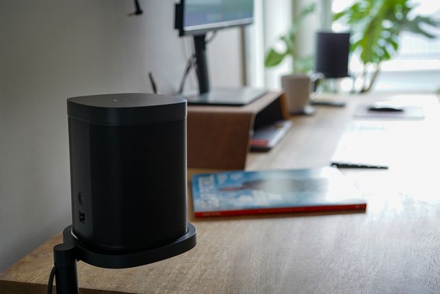 sonos speakers on a desk next to a computer
