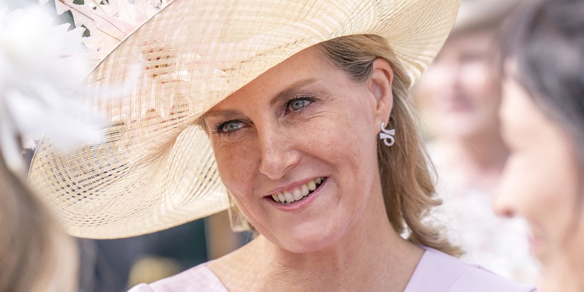 The Countess of Wessex is pretty in pink in a long sleeve midi dress for a special garden party