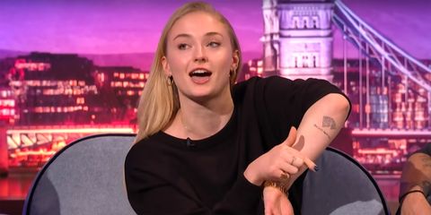 Sophie Turner showing her tattoo on the Late Late Show