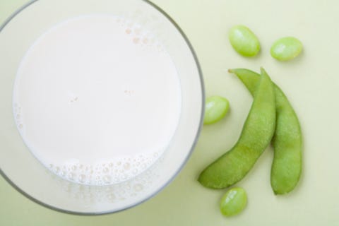 Soy milk and edamame, studio shot Soy milk and edamame, studio shot