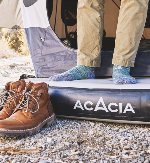 someone standing on a space acacia tent