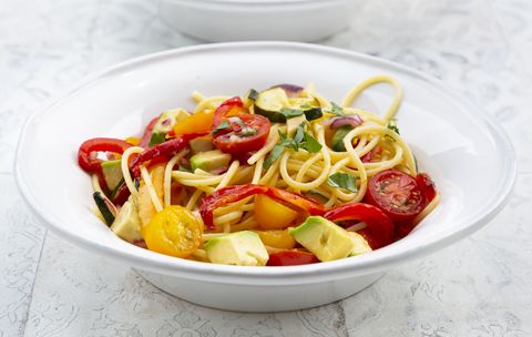 spaghetti with grilled vegetables, paprika, zucchini, avocado, tomato and coriander