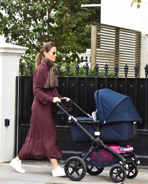EXCLUSIVE: Is Pippa Middleton back at the gym already? Pippa is seen with a pink Wilson tennis bag and racket as she takes her new baby for a walk.