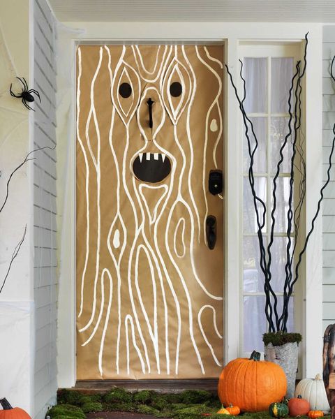 eerie entryway made from craft paper and white paint to look like a treet