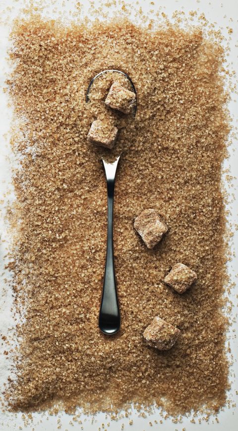 spoon in heap of turbinado sugar
