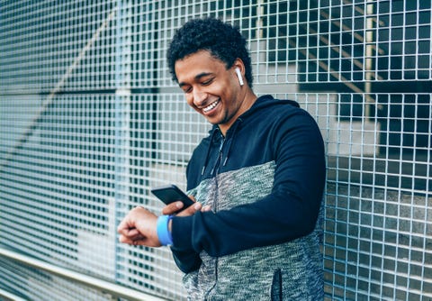 sportsman checking his smart watch