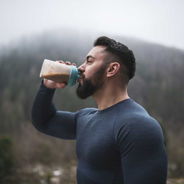 sportsman drinking protein outdoor