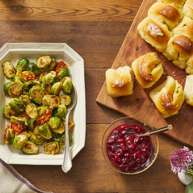 sweet and sour brussels sprouts, cranberry apple sauce, and orange thyme parker house rolls