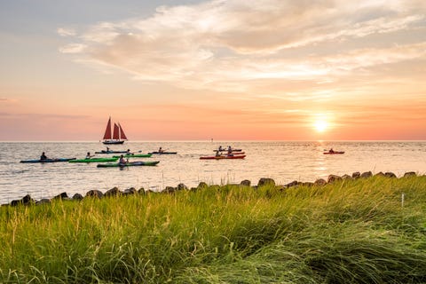 springer's point on ocracoke island with kayakers and sailboat