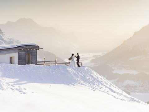 wedding couple arrival at the mountain hut for dinner, engadin st moritz