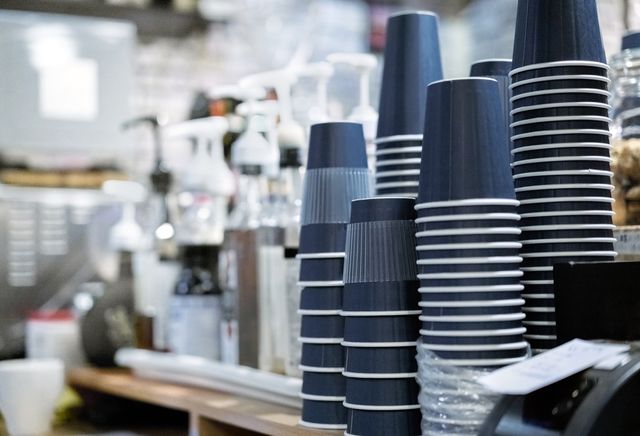 stack of upside down disposable cups at cafe