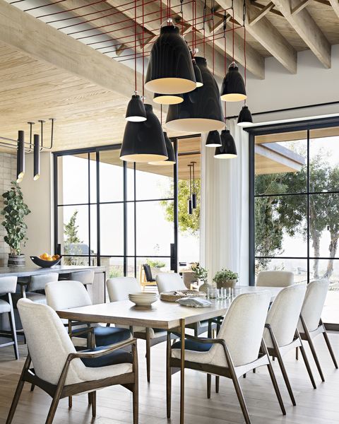 dining room with staggered pendant lights