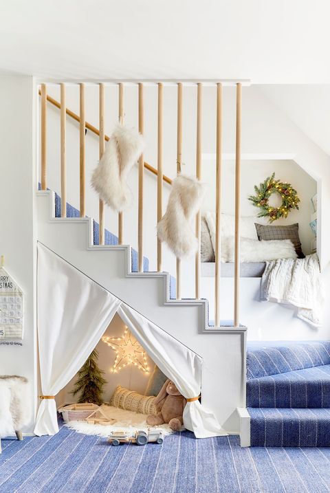 white staircase with blue rug and white fur stockings