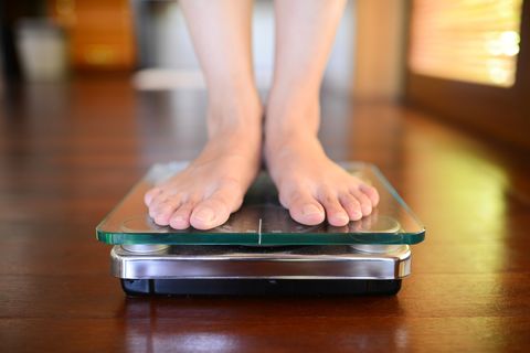 standing on weight scale