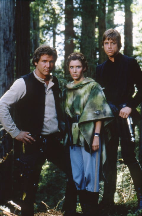 star wars   return of the jedi, harrison ford as han, carrie fisher as leia, mark hamill as luke, standing in forest