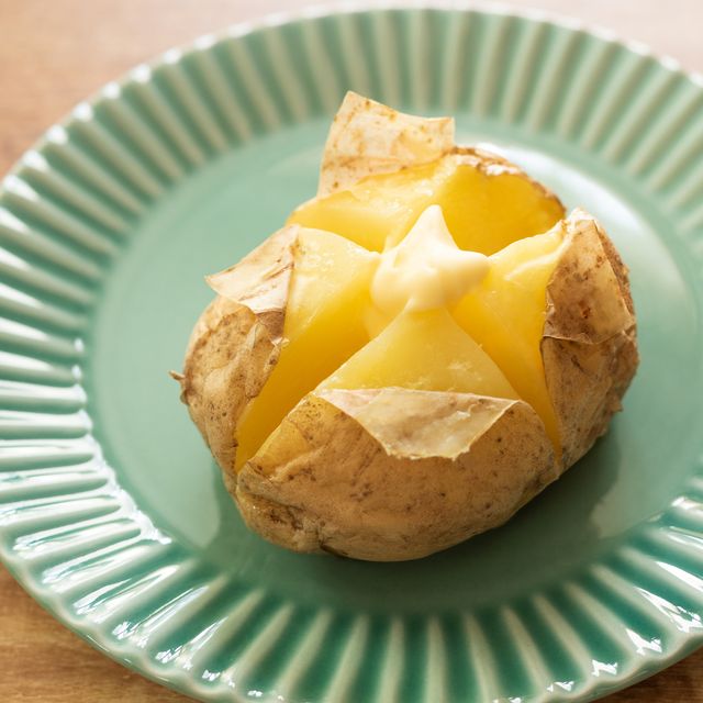 steamed potato with butter on plate