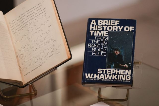 a picture shows the book a brief history of time by theoretical physicist stephen hawking signed with a thumbprint with an estimate price of gbp £2,000 £3,000 gbp during a photocall for the sale of personal items from hawkings estate at christies auction house in london on october 30, 2018 photo by daniel leal  afp photo by daniel lealafp via getty images